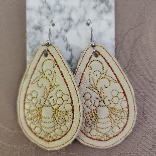 Leather Earings with Bees Embroidered on them